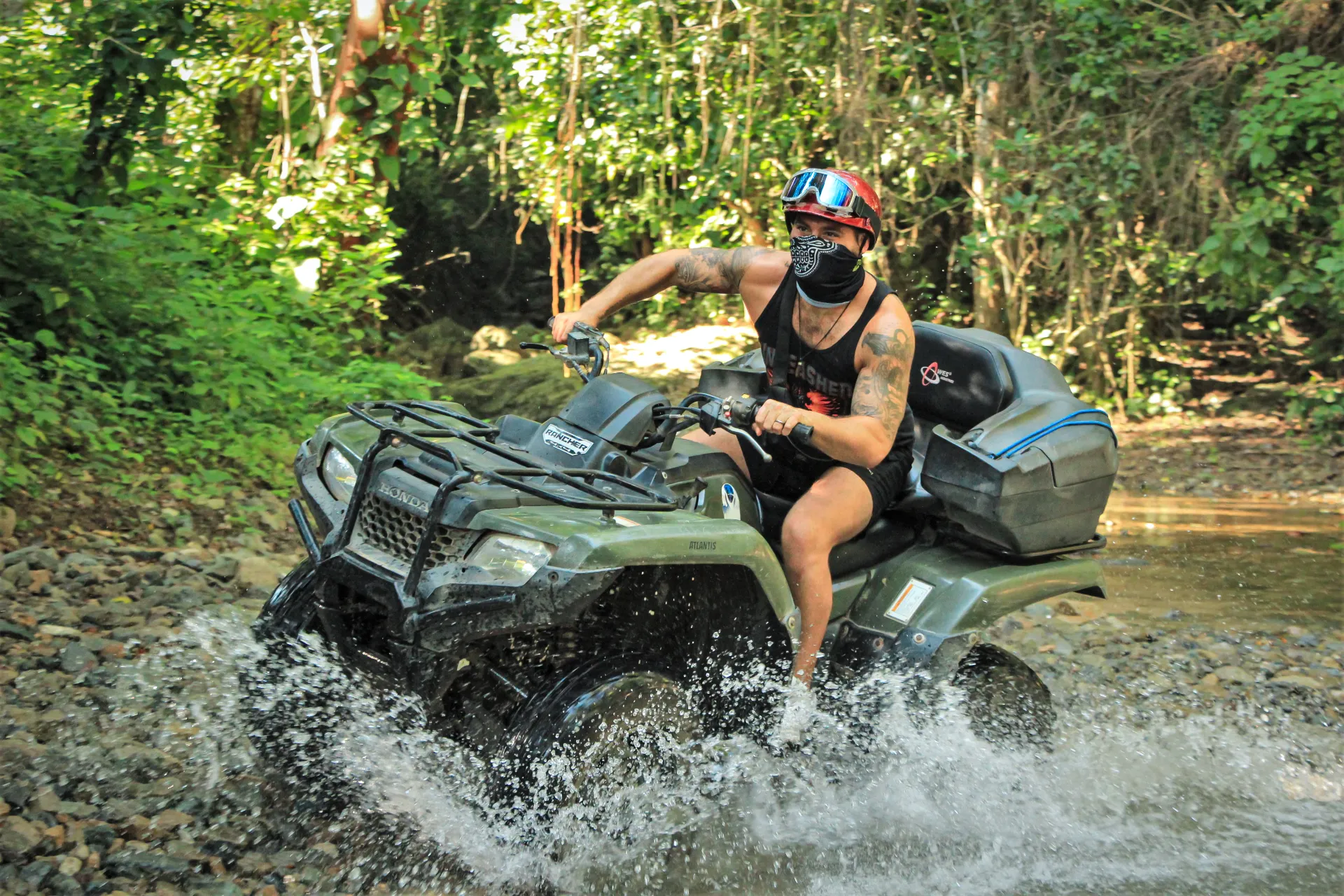 A man enjoying an adventurous ATV tour with Xiutla Riders EcoAdventures